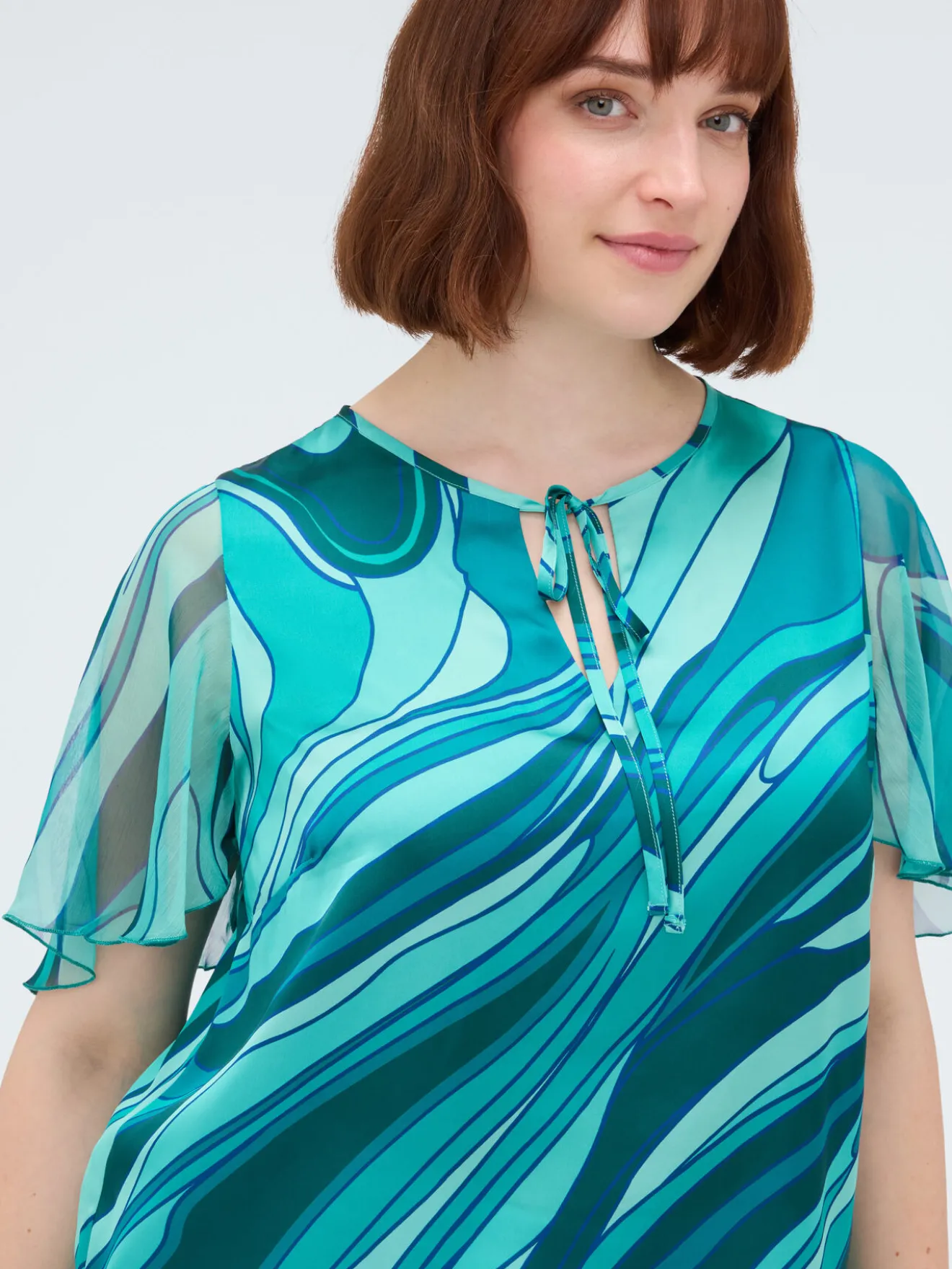 Blusa bimaterica con stampa