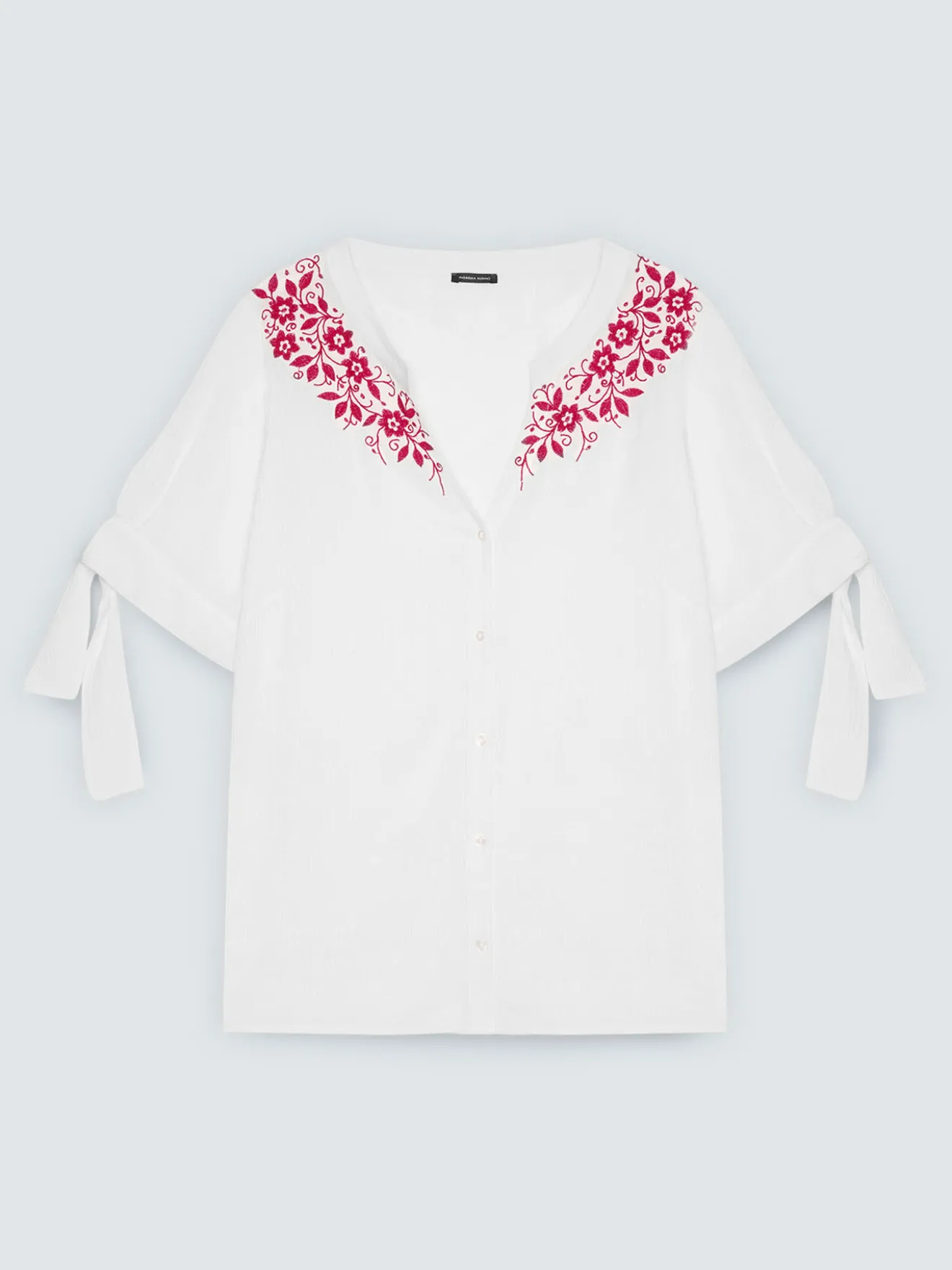 Blusa con ricami floreali