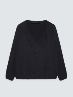 Blusa in plumetis a pois con volant