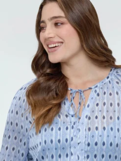 Blusa in tessuto lurex con stampa