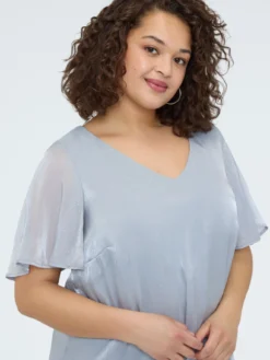 Blusa texture metallizzata con punti luce
