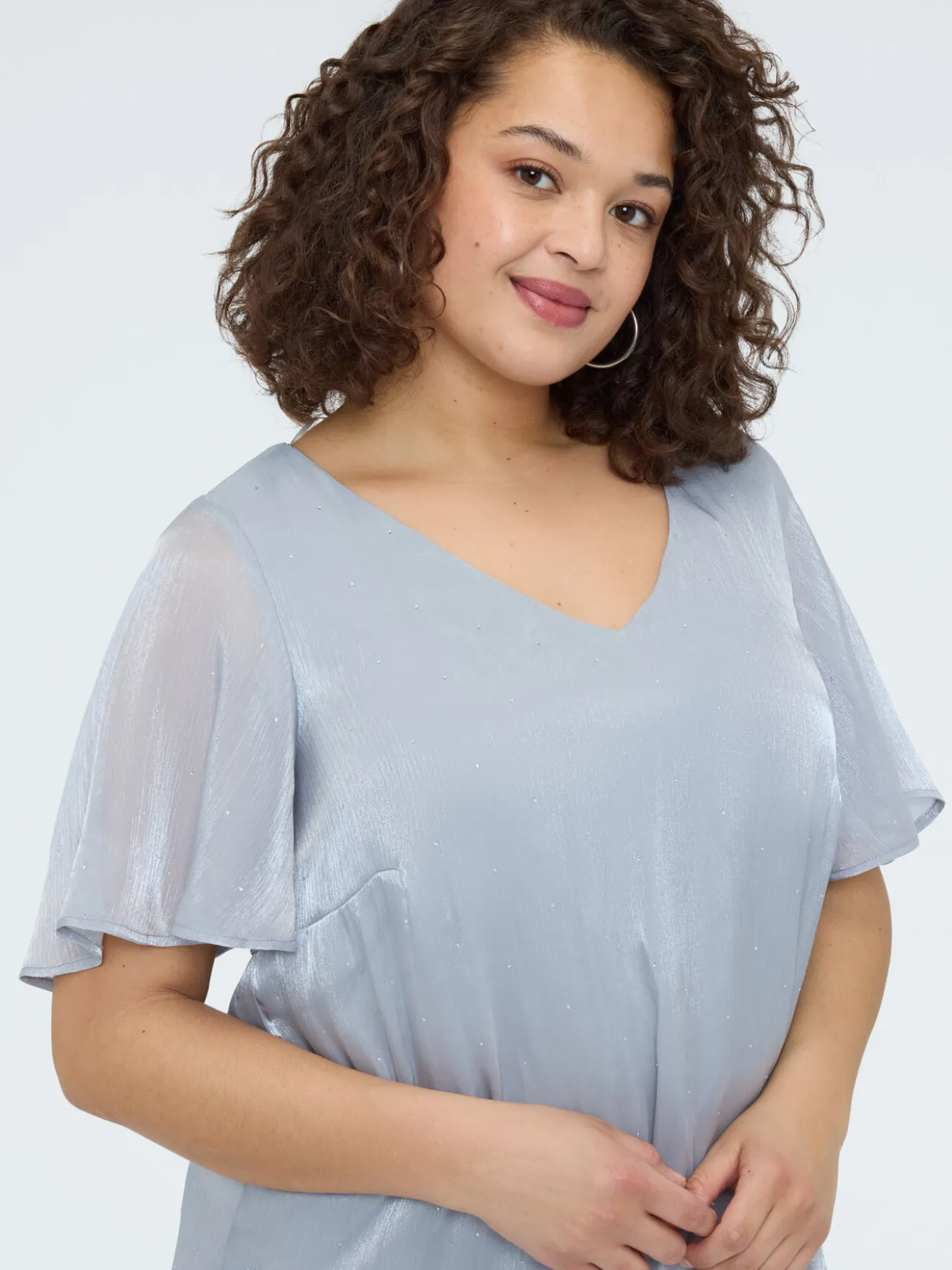 Blusa texture metallizzata con punti luce