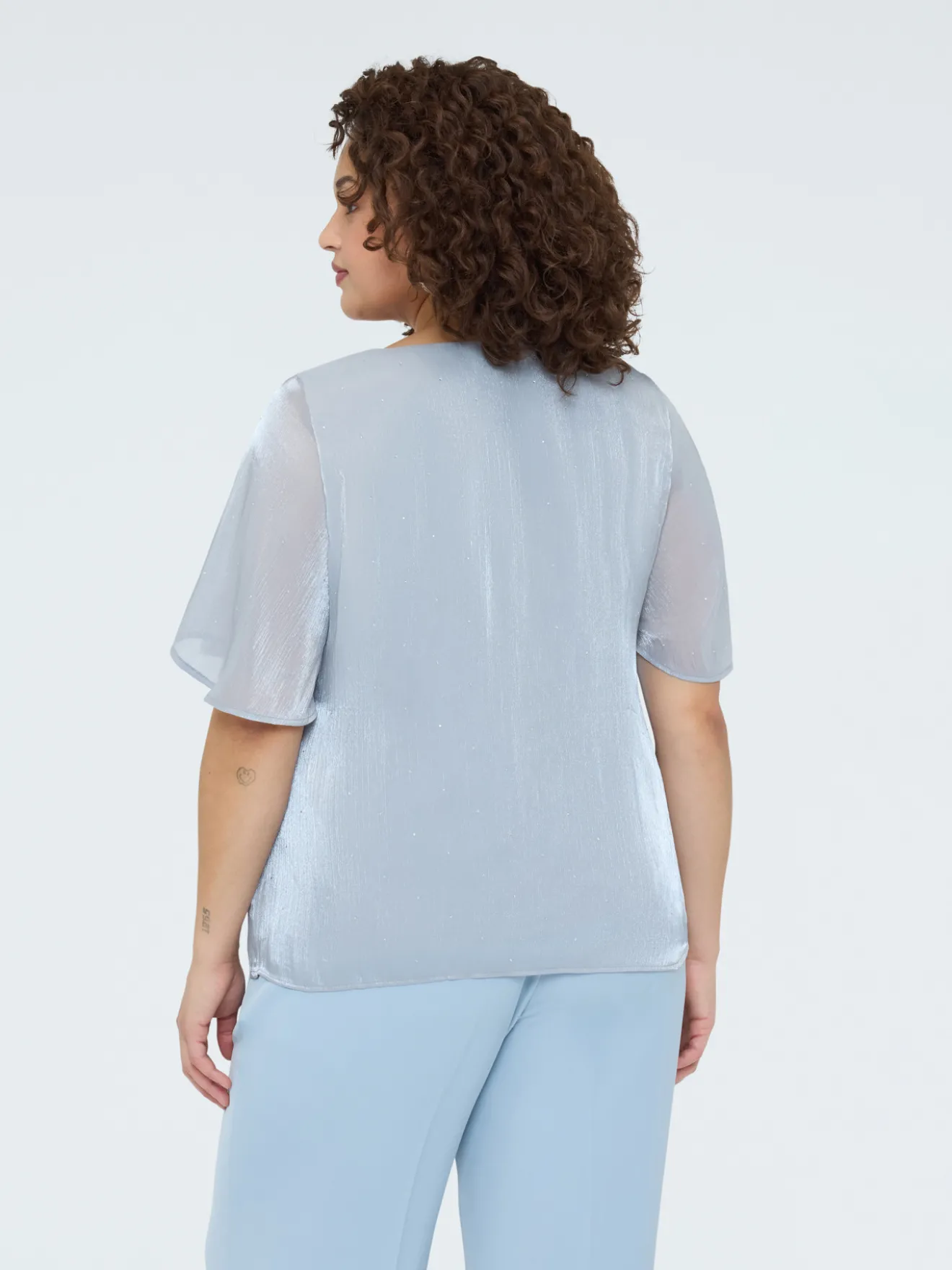 Blusa texture metallizzata con punti luce