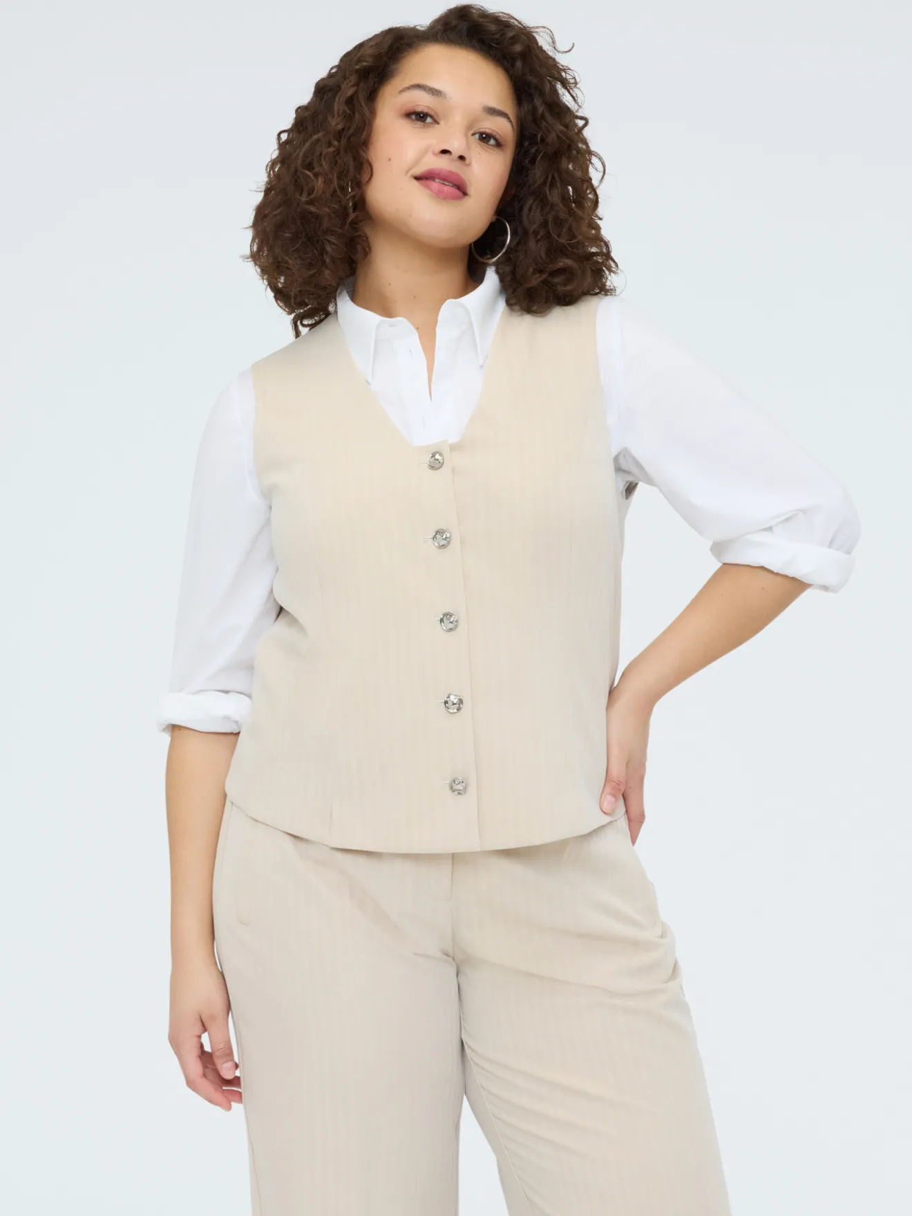 Gilet con bottoni gioiello