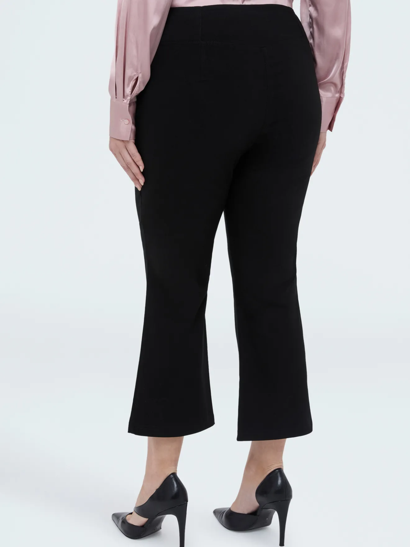 Pantaloni Kick Flare vita elasticizzata asimmetrica
