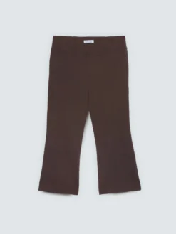 Pantaloni Kick Flare vita elasticizzata asimmetrica