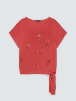 Top con applicazioni paillettes e nodo