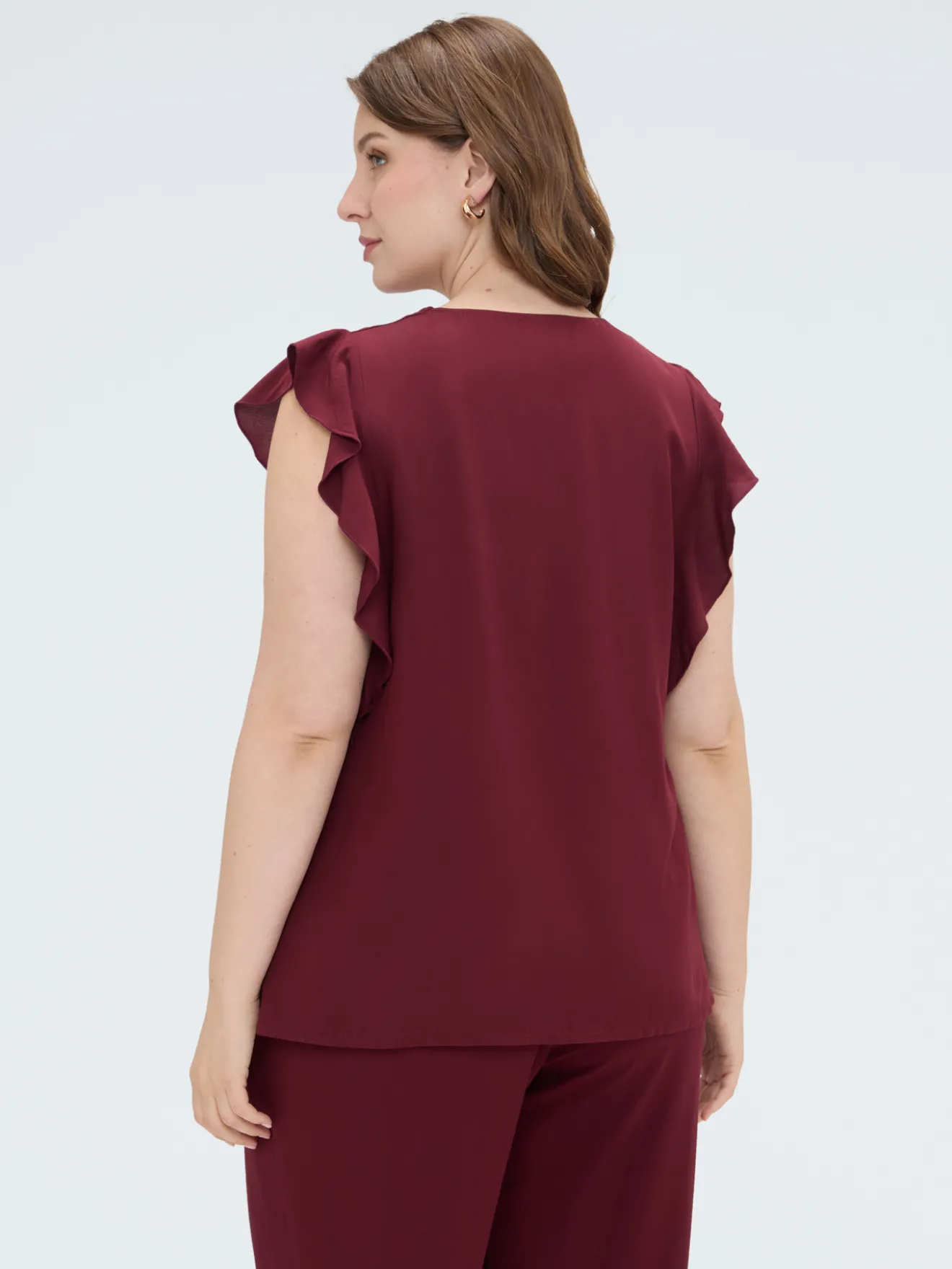 Top in mussola con volant sulle spalle