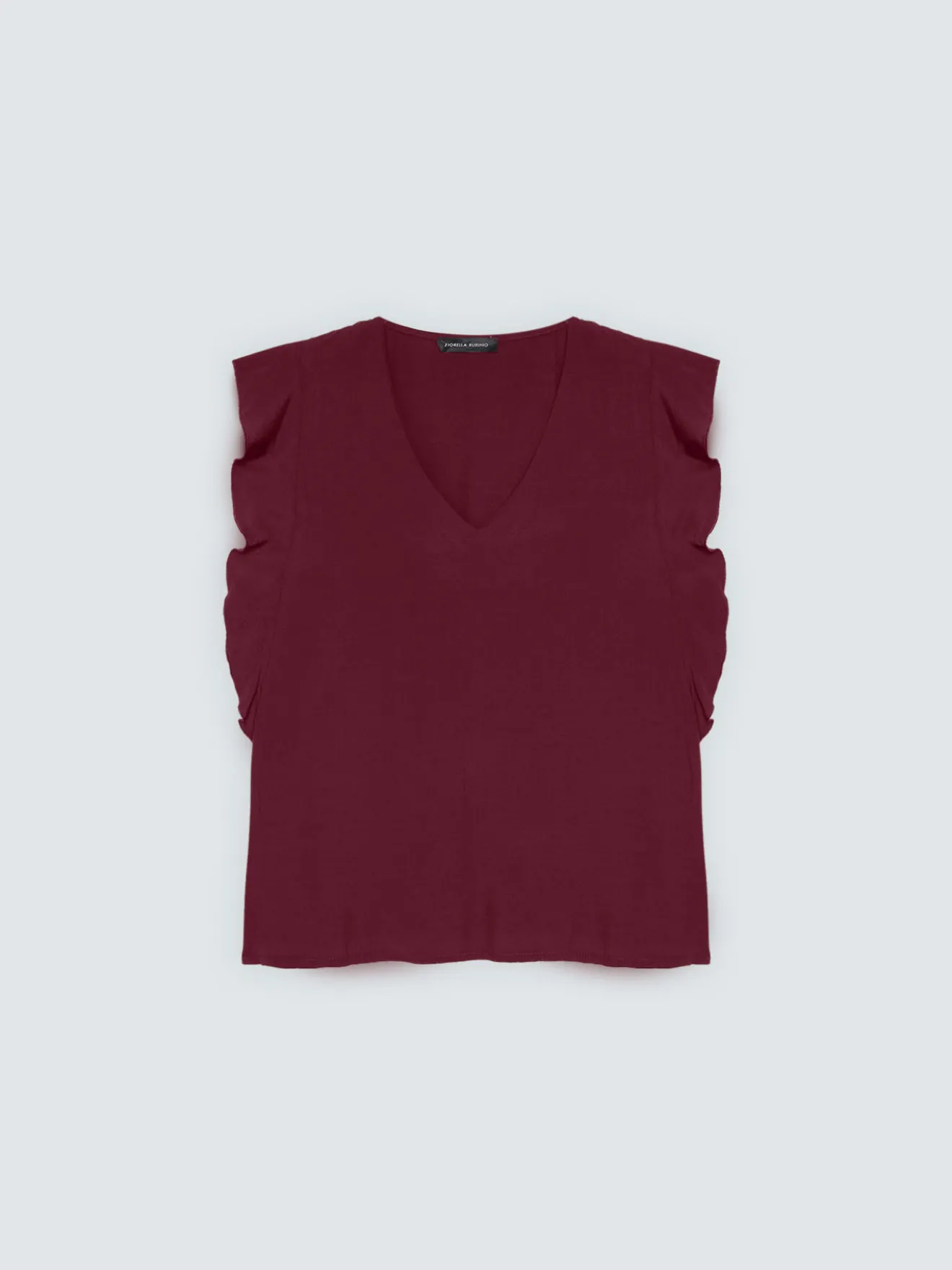 Top in mussola con volant sulle spalle
