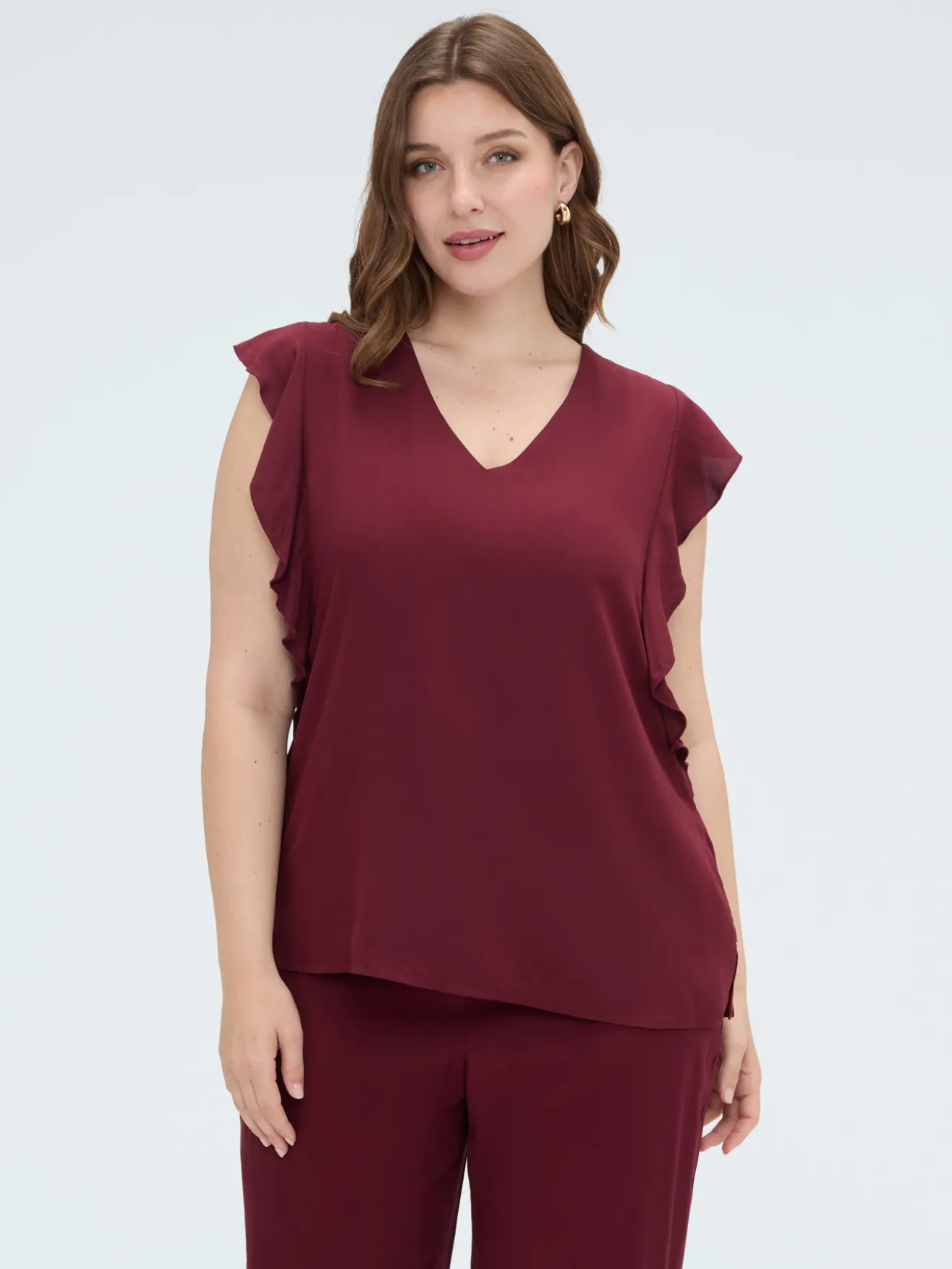Top in mussola con volant sulle spalle