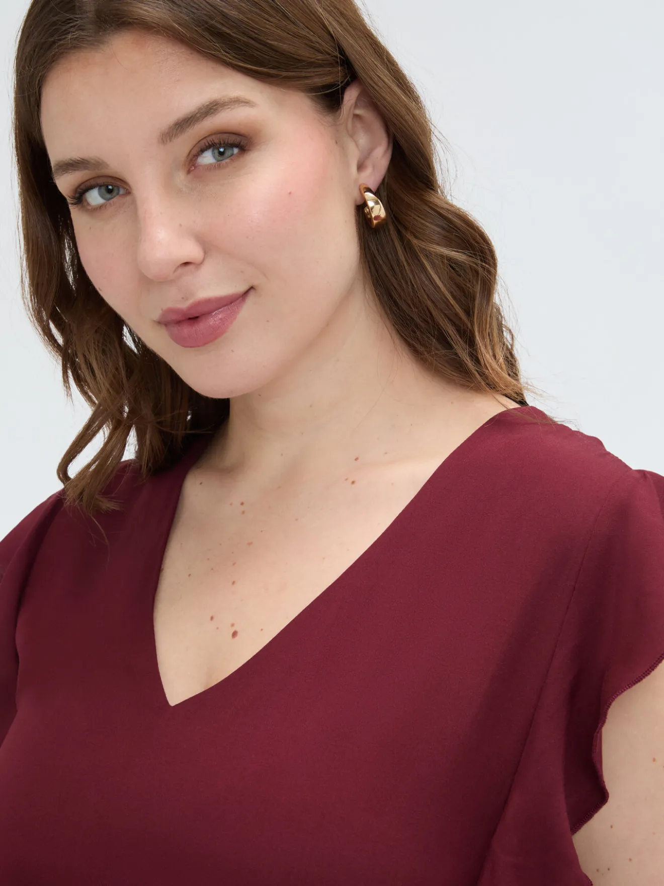 Top in mussola con volant sulle spalle